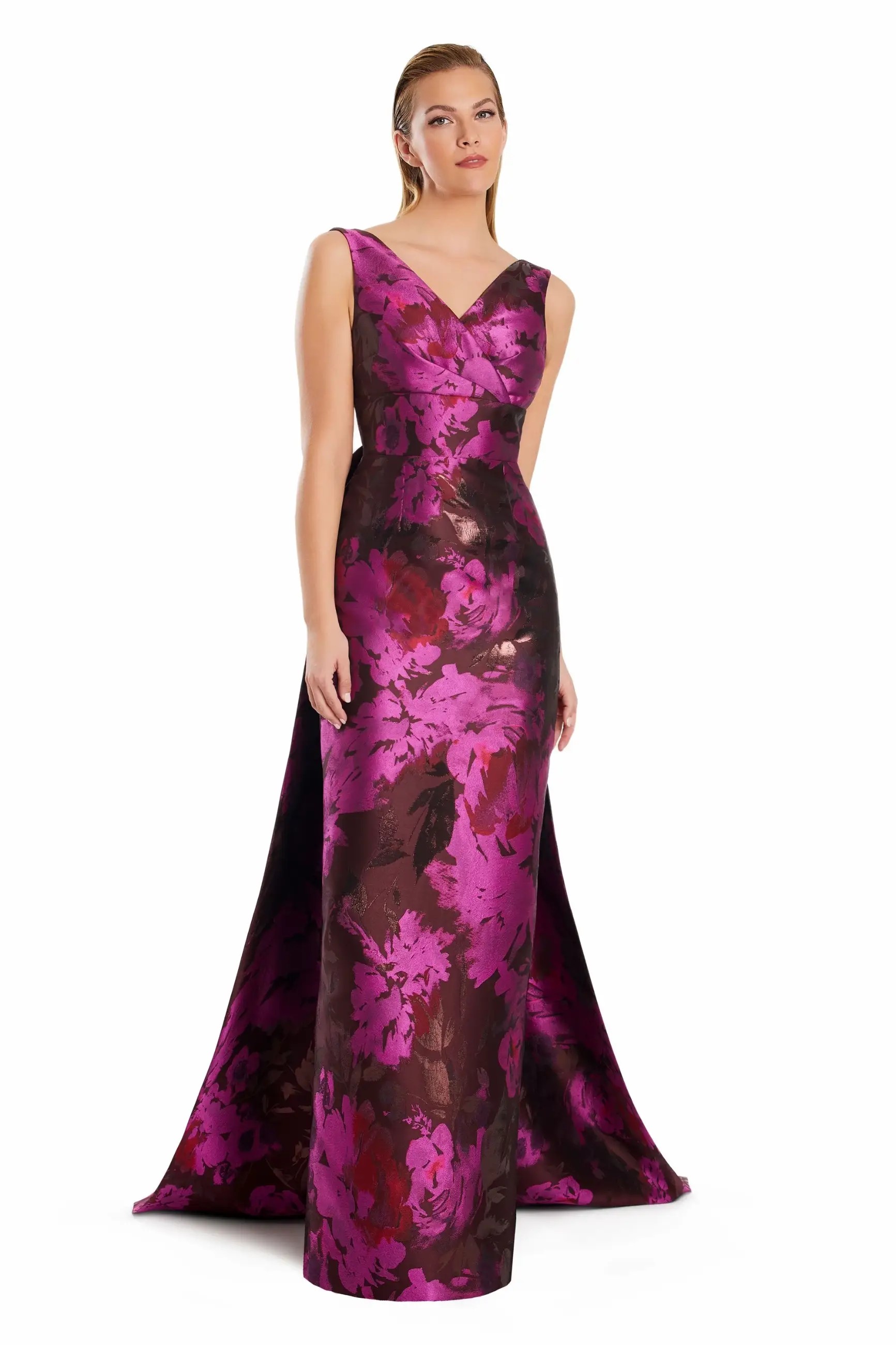 Model is wearing a sleeveless floral black and blue evening gown
