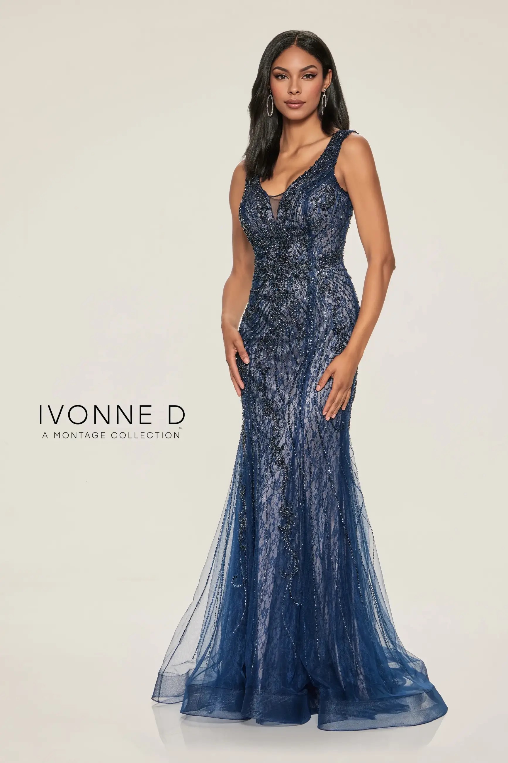 Model is wearing a mermaid mother of the bride gown with lace